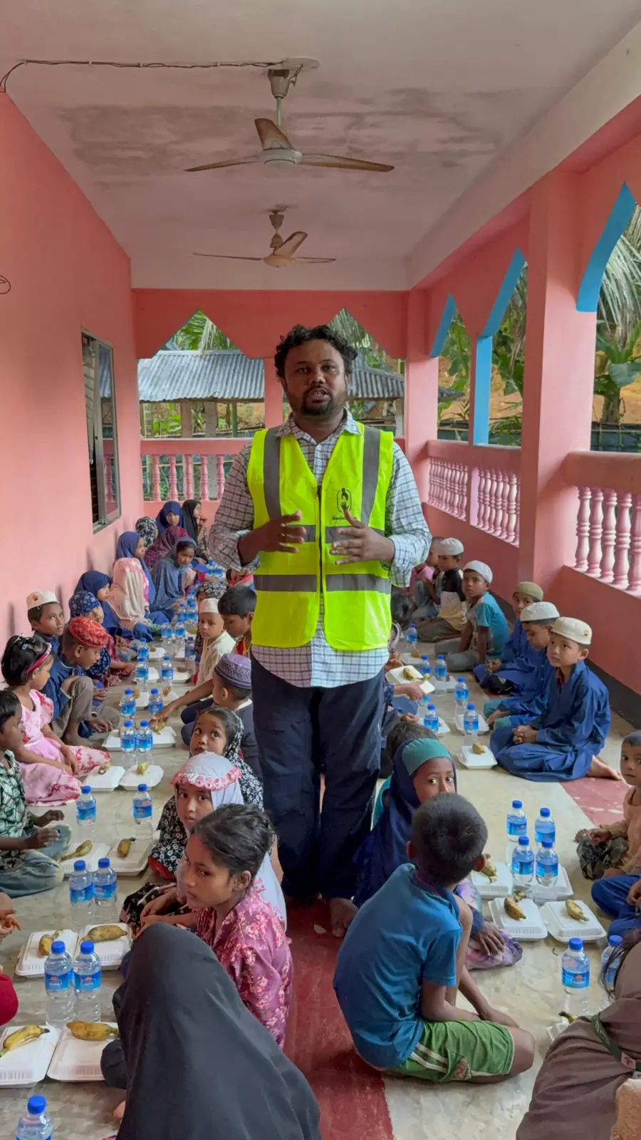 Social Care team member during a hot-meal distribution for children
