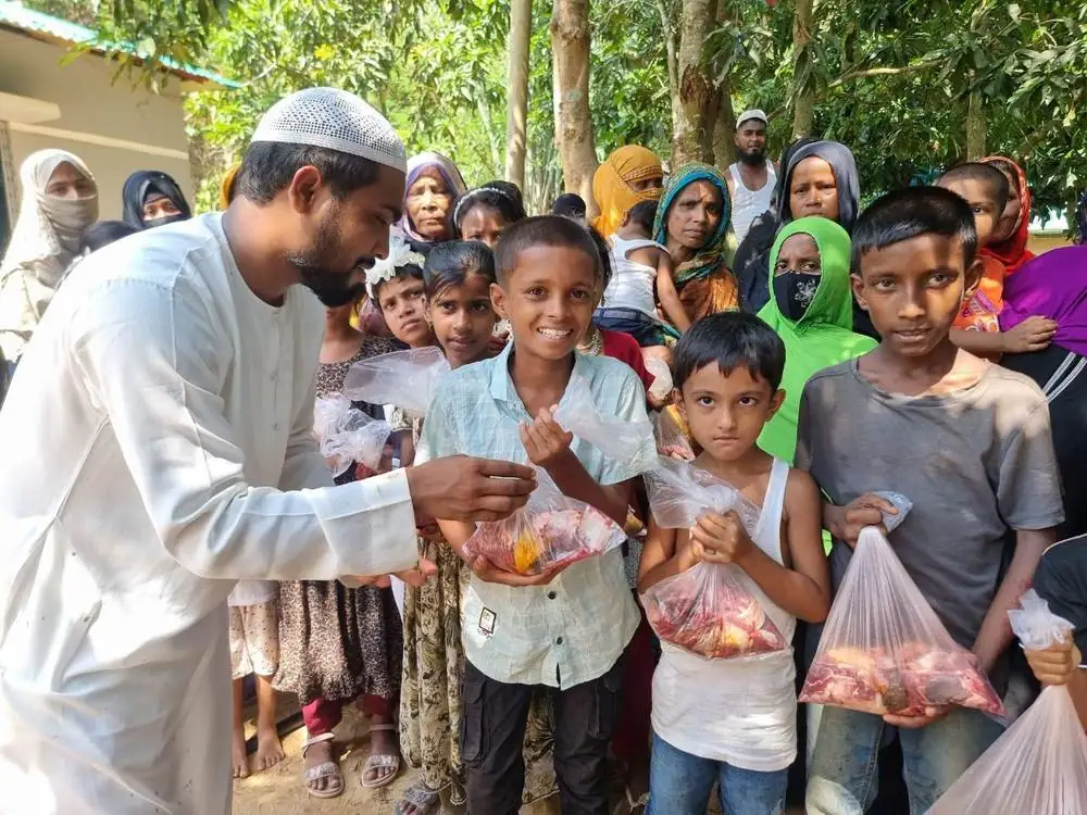 Social Care team distributing Qurbani meat to children